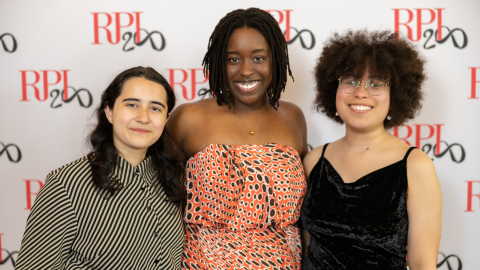 three college students in front of an RPI backdrop