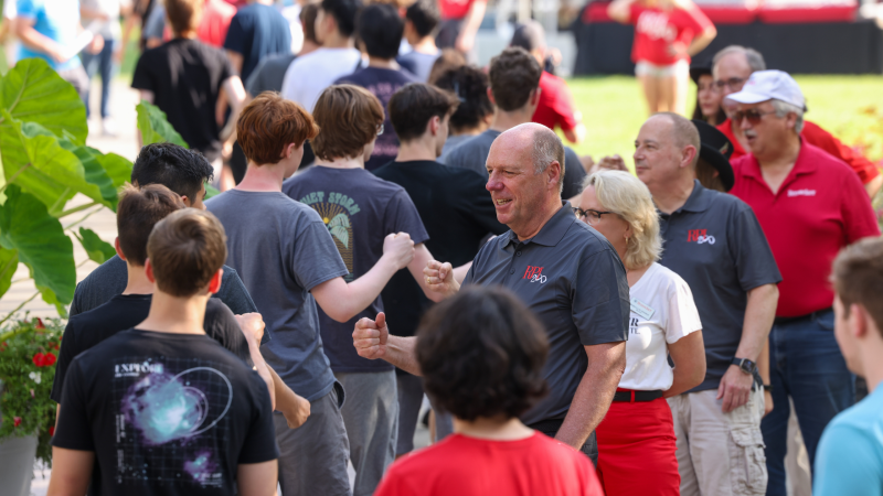Students Fist Bumping Administration During Orientation