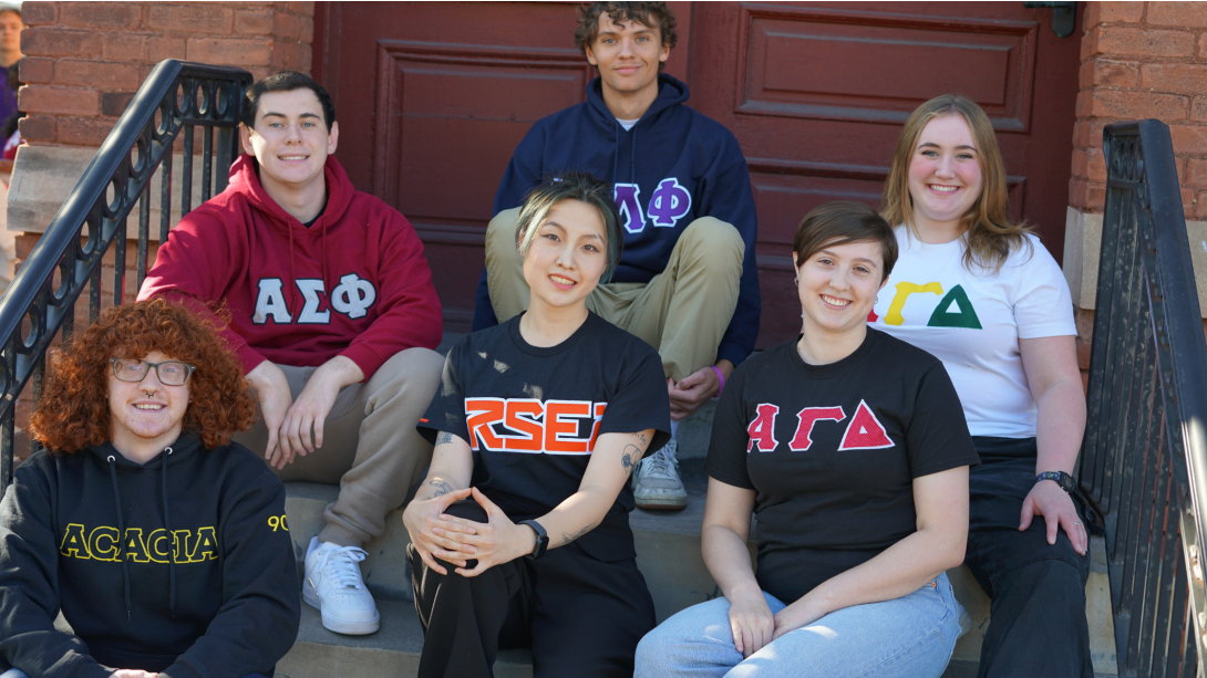 Students sitting on steps outside