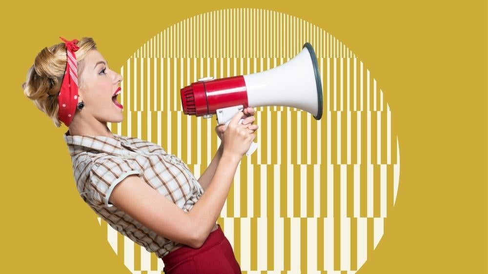 Woman yelling through megaphone